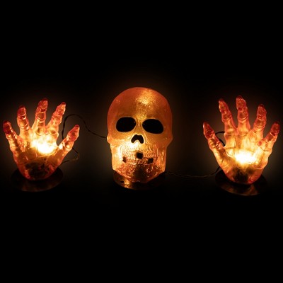  Northlight LED Lighted Skull And Hands Outdoor Halloween Decoration - 4' Black Wire - Orange