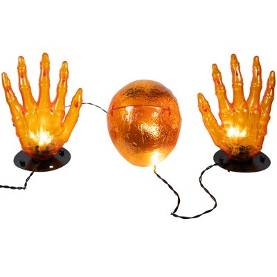  Northlight LED Lighted Skull And Hands Outdoor Halloween Decoration - 4' Black Wire - Orange