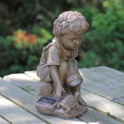  Northlight 12.25" Solar Powered LED Lighted Boy Examining Turtle With Flashlight Outdoor Garden Statue