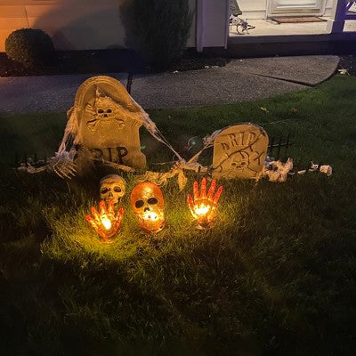  Northlight LED Lighted Skull And Hands Outdoor Halloween Decoration - 4' Black Wire - Orange