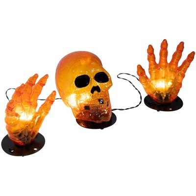  Northlight LED Lighted Skull And Hands Outdoor Halloween Decoration - 4' Black Wire - Orange
